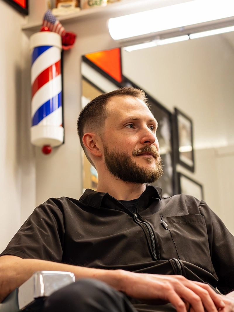 Portrait image of Daniel. Owner and a barber at the Quaker Village Barber & Style Shop in Greensboro, NC.