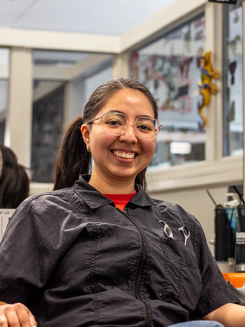 Portrait image of Eurydice. A barber at the Quaker Village Barber & Style Shop in Greensboro, NC.